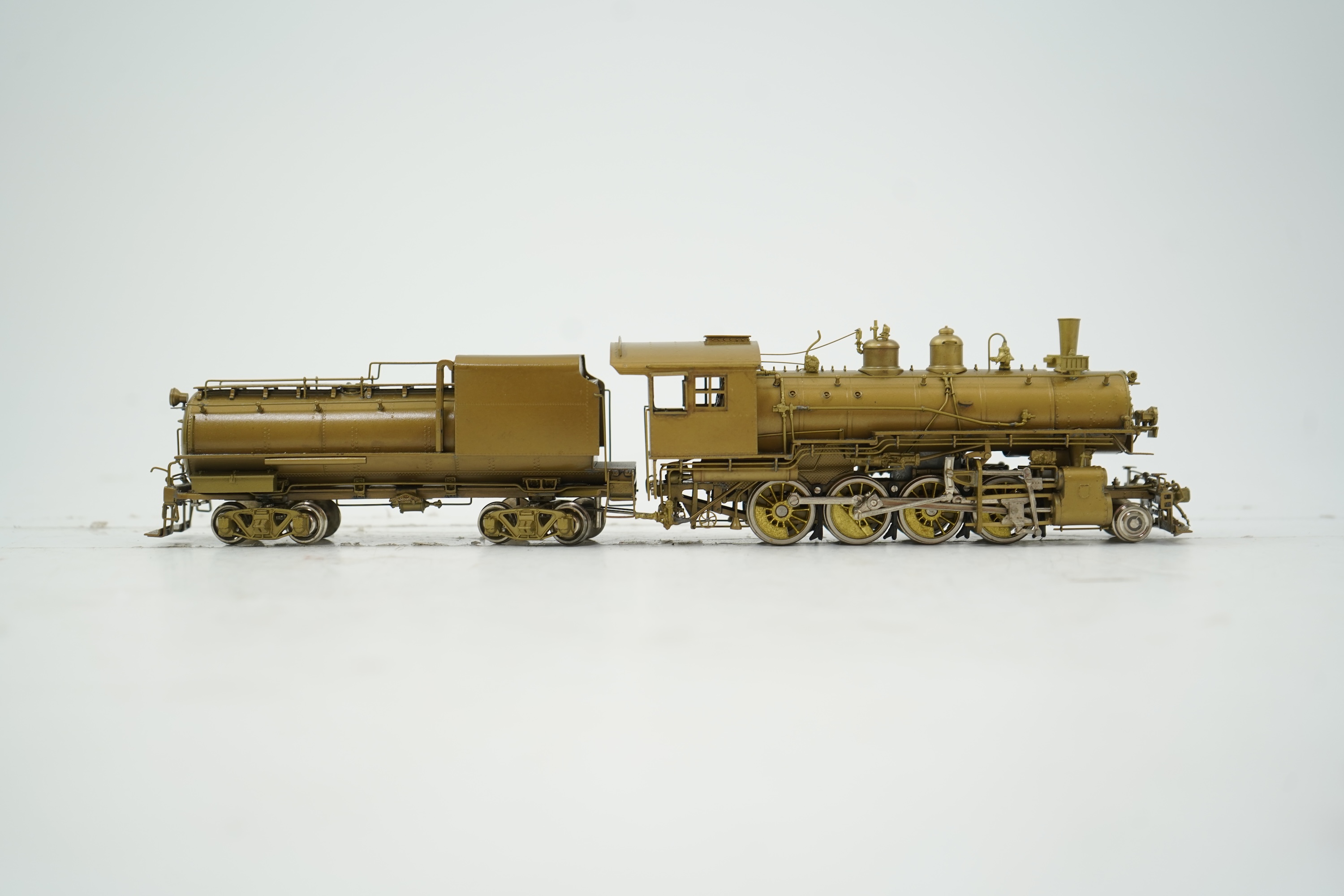 A boxed HO gauge Overland Models Inc. J.P.M. unpainted brass model of Union Pacific Railway C-57, 2-8-0 locomotive with bogie tender, powered for two rail operation.